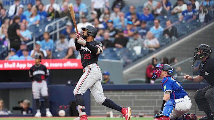 Aug 27, 2025; Toronto, Ontario, CAN; Minnesota Twins centre fielder Byron Buxton (25) hits a home run against the Toronto Blue Jays during the first inning at Rogers Centre. Mandatory Credit: Nick Turchiaro-Imagn Images