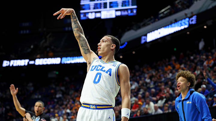 Mar 20, 2025; Lexington, KY, USA;  UCLA Bruins guard Kobe Johnson (0) shoots the ball during the second half against the Utah State Aggies in the first round of the NCAA Tournament at Rupp Arena. Mandatory Credit: Jordan Prather-Imagn Images