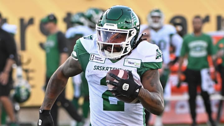 Jun 16, 2024; Hamilton, Ontario, CAN; Saskatchewan Rough Riders wide receiver Mario Alford (2) carries the ball in the first quarter against the Hamilton Tiger Cats at Tim Hortons Field. Mandatory Credit: Gerry Angus-Imagn Images