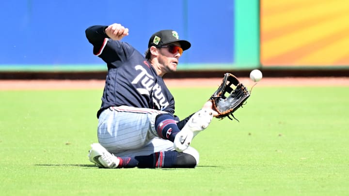 Mar 17, 2026; Clearwater, Florida, USA; Minnesota Twins left fielder Ryan Kreidler (5) makes a sliding catch in the second inning against the Philadelphia Phillies during spring training at BayCare Ballpark. Mandatory Credit: Jonathan Dyer-Imagn Images Mar 17, 2026; Clearwater, Florida, USA; Minnesota Twins left fielder Ryan Kreidler (5) makes a sliding catch in the second inning against the Philadelphia Phillies during spring training at BayCare Ballpark. Mandatory Credit: Jonathan Dyer-Imagn Images