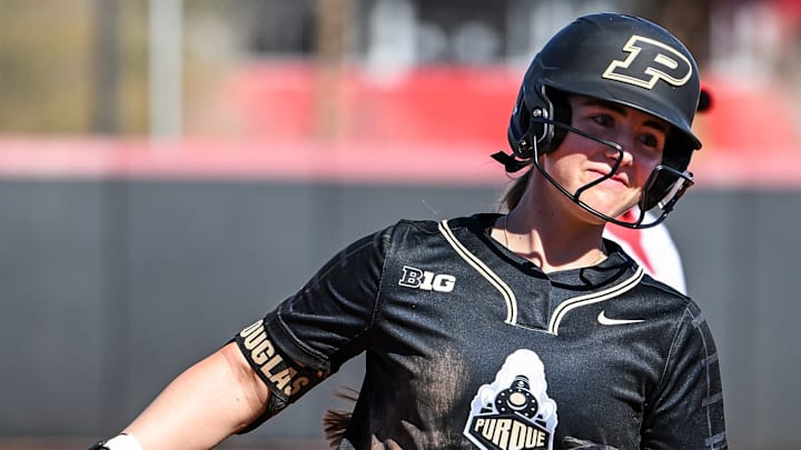 Bella Douglas rounds the bases after hitting a grand slam for the Purdue Boilermakers.