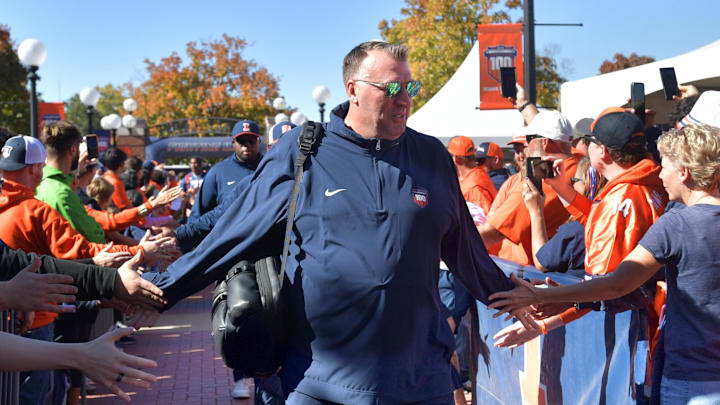 Oct 19, 2024; Champaign, Illinois, USA; Illinois Fighting Illini head coach Bret Bielema leads his team into the stadium before kickoff against the Michigan Wolverines game at Memorial Stadium. Mandatory Credit: Ron Johnson-Imagn Images