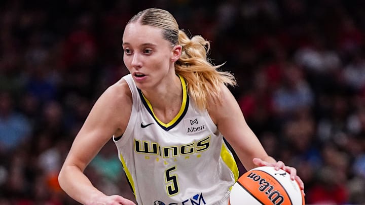 Dallas Wings guard Paige Bueckers (5) rushes up the court Tuesday, Aug. 12, 2025, during the game at Gainbridge Fieldhouse in Indianapolis. The Dallas Wings defeated the Indiana Fever, 81-80.