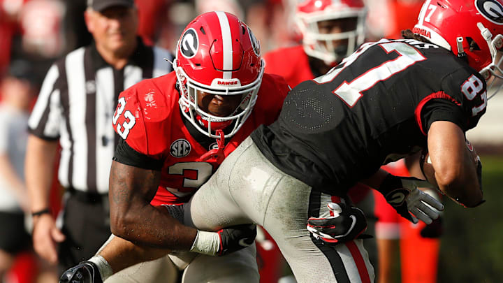 Georgia inside linebacker C.J. Allen (33) tackles Georgia wide receiver Mekhi Mews (87) during the UGA G-Day spring football game at Sanford Stadium in Athens, Ga., on Saturday, April 15, 2023. Red won 31-26.