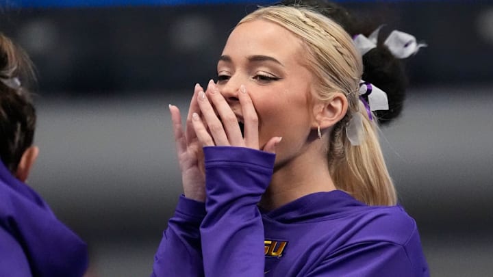 LSU gymnast Livvy Dunne stretches with teammates before Session 2 of the SEC Gymnastics Tournament at Legacy Arena in Birmingham, Alabama. LSU gymnast Livvy Dunne stretches with teammates before Session 2 of the SEC Gymnastics Tournament at Legacy Arena in Birmingham, Alabama.
