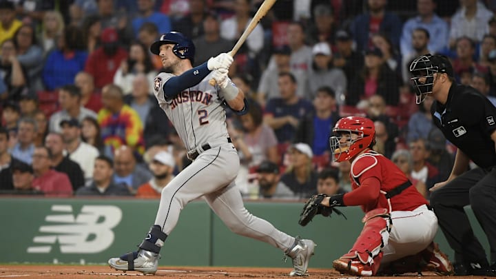 Aug 29, 2023; Boston, Massachusetts, USA;  Houston Astros third baseman Alex Bregman (2) hits a home run during the first inning against the Boston Red Sox at Fenway Park. Mandatory Credit: Bob DeChiara-Imagn Images