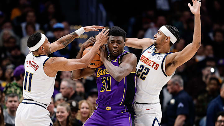 Jan 9, 2023; Denver, Colorado, USA; Los Angeles Lakers center Thomas Bryant (31) controls the ball under pressure from Denver Nuggets forward Bruce Brown (11) and forward Zeke Nnaji (22) in the fourth quarter at Ball Arena. Mandatory Credit: Isaiah J. Downing-Imagn Images Jan 9, 2023; Denver, Colorado, USA; Los Angeles Lakers center Thomas Bryant (31) controls the ball under pressure from Denver Nuggets forward Bruce Brown (11) and forward Zeke Nnaji (22) in the fourth quarter at Ball Arena. Mandatory Credit: Isaiah J. Downing-Imagn Images