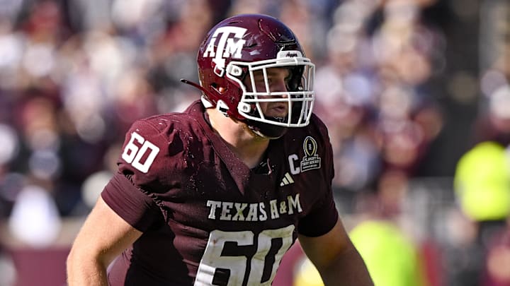 Dec 20, 2025; College Station, TX, USA; Texas A&M Aggies offensive lineman Trey Zuhn III (60) blocks the rush during the game between the Aggies and the Hurricanes at Kyle Field. Mandatory Credit: Jerome Miron-Imagn Images
