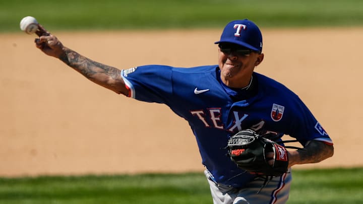 Aug 16, 2020; Denver, Colorado, USA; Texas Rangers relief pitcher Jesse Chavez (30) pitches in the seventh inning against the Colorado Rockies at Coors Field. 