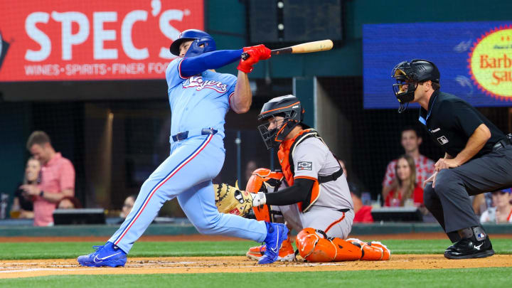 Jun 9, 2024; Arlington, Texas, USA; Texas Rangers designated hitter Wyatt Langford (36) his a two-run double during the first inning against the San Francisco Giants at Globe Life Field. 