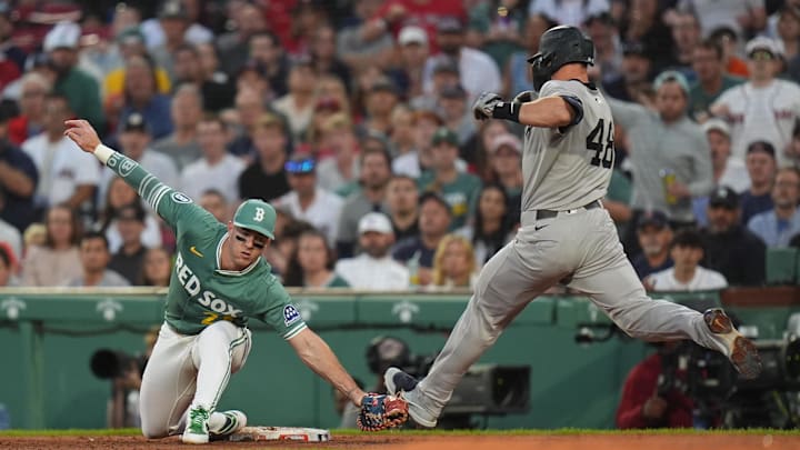 Jun 13, 2025; Boston, Massachusetts, USA; Boston Red Sox first base Romy Gonzalez (23) makes the out to end the half against New York Yankees first base Paul Goldschmidt (48) in the fifth inning at Fenway Park. Mandatory Credit: David Butler II-Imagn Images