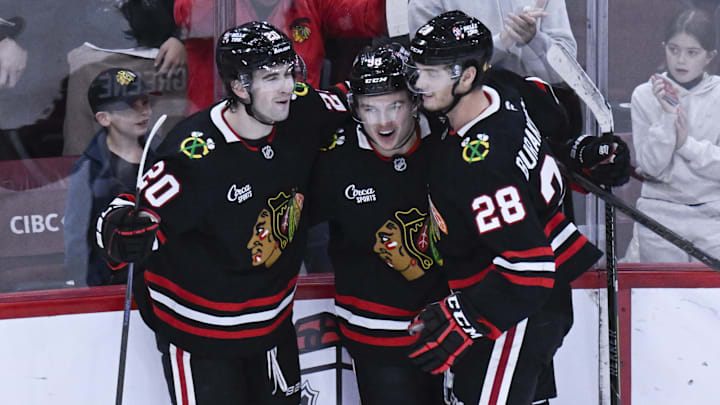 Nov 30, 2025; Chicago, Illinois, USA; Chicago Blackhawks center Connor Bedard (98) celebrates with center Ryan Greene (20) and left wing Andre Burakovsky (28) after he scores a goal against the Anaheim Ducks during the third period at United Center. Mandatory Credit: Matt Marton-Imagn Images Nov 30, 2025; Chicago, Illinois, USA; Chicago Blackhawks center Connor Bedard (98) celebrates with center Ryan Greene (20) and left wing Andre Burakovsky (28) after he scores a goal against the Anaheim Ducks during the third period at United Center. Mandatory Credit: Matt Marton-Imagn Images