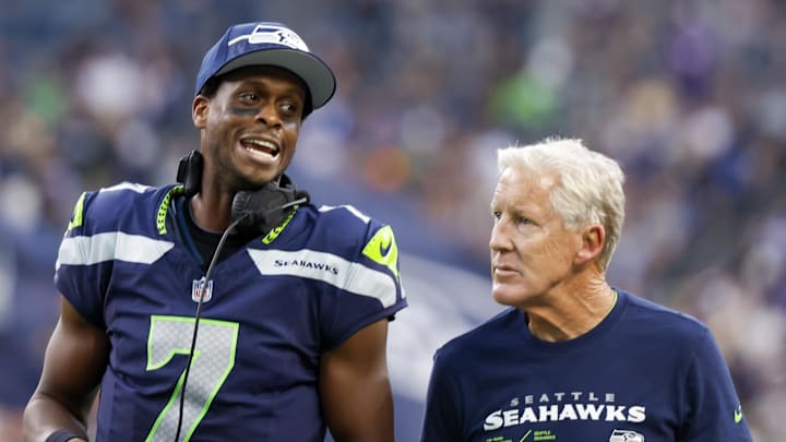 Seattle Seahawks quarterback Geno Smith talks to Pete Carroll during a game. Seattle Seahawks quarterback Geno Smith talks to Pete Carroll during a game.