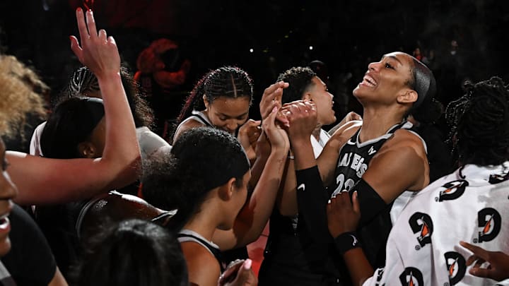 Aug 21, 2025; Las Vegas, Nevada, USA; Las Vegas Aces center A'ja Wilson (22) and teammates celebrate defeating the Phoenix Mercury at Michelob Ultra Arena. 