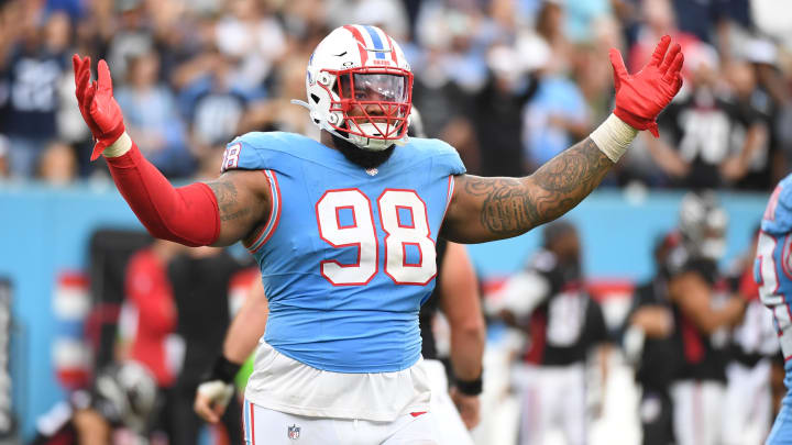 Oct 29, 2023; Nashville, Tennessee, USA; Tennessee Titans defensive tackle Jeffery Simmons (98) celebrates late in the second half of a win against the Atlanta Falcons at Nissan Stadium. Mandatory Credit: Christopher Hanewinckel-USA TODAY Sports