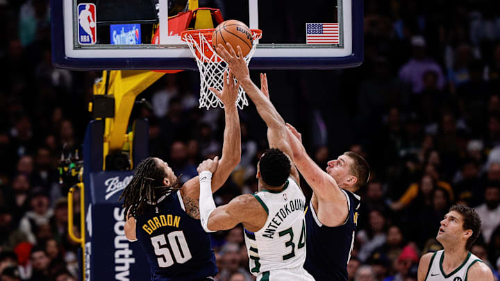  Milwaukee Bucks forward Giannis Antetokounmpo (34) battles for a rebound with Denver Nuggets forward Aaron Gordon (50) and center Nikola Jokic (15) in the fourth quarter at Ball Arena. Mandatory Credit: Isaiah J. Downing-Imagn Images