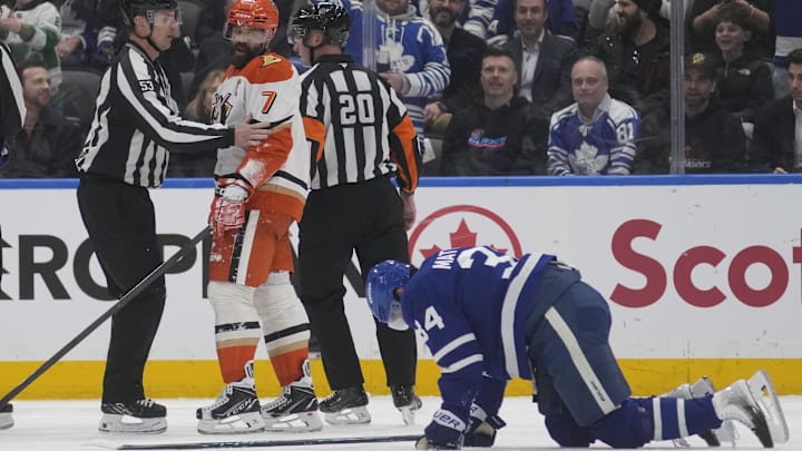 Mar 12, 2026; Toronto, Ontario, CAN; Anaheim Ducks defenseman Radko Gudas (7) looks at an injured Toronto Maple Leafs forward Auston Matthews (34) after he delivered a knee on knee hit during the second period at Scotiabank Arena. Mandatory Credit: John E. Sokolowski-Imagn Images Mar 12, 2026; Toronto, Ontario, CAN; Anaheim Ducks defenseman Radko Gudas (7) looks at an injured Toronto Maple Leafs forward Auston Matthews (34) after he delivered a knee on knee hit during the second period at Scotiabank Arena. Mandatory Credit: John E. Sokolowski-Imagn Images