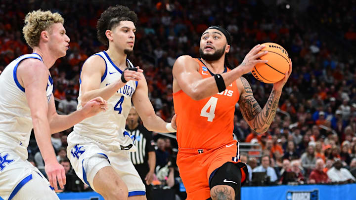 Mar 23, 2025; Milwaukee, WI, USA;  Illinois Fighting Illini guard Kylan Boswell (4) drives to the basket against Kentucky Wildcats guard Koby Brea (4) during the first half in the second round of the NCAA Tournament at Fiserv Forum. Mandatory Credit: Benny Sieu-Imagn Images