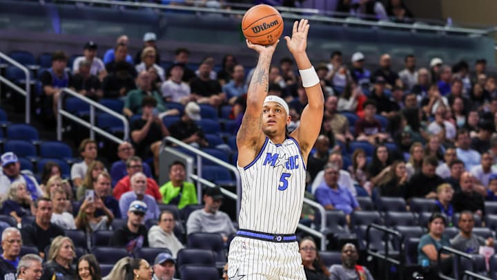 Oct 16, 2025; Orlando, Florida, USA; Orlando Magic forward Paolo Banchero (5) shoots a three point basket during the first quarter against the New Orleans Pelicans at Kia Center. Mandatory Credit: Mike Watters-Imagn Images