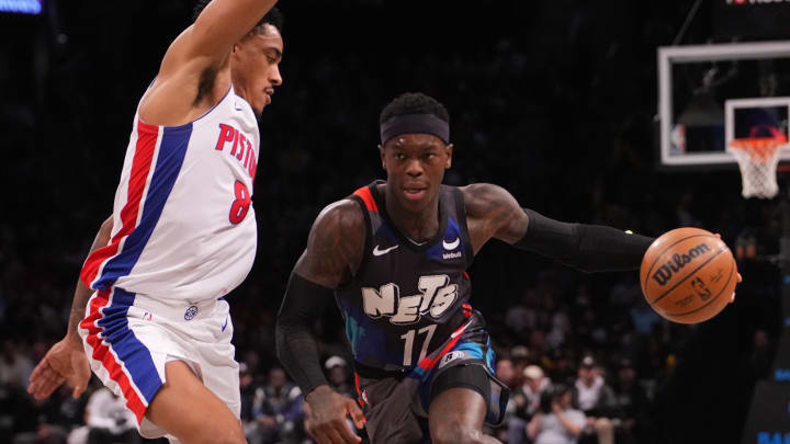 Apr 6, 2024; Brooklyn, New York, USA; Brooklyn Nets point guard Dennis Schroder (17) dribbles the ball against Detroit Pistons guard Jared Rhoden (8) during the second half at Barclays Center. Mandatory Credit: Gregory Fisher-USA TODAY Sports