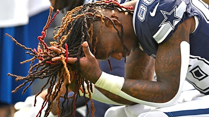 Dallas Cowboys wide receiver CeeDee Lamb sits on the bench against the Los Angeles Rams at SoFi Stadium. 