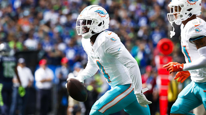 Miami Dolphins cornerback Kader Kohou (4) celebrates following an interception against the Seattle Seahawks during the first quarter at Lumen Field.