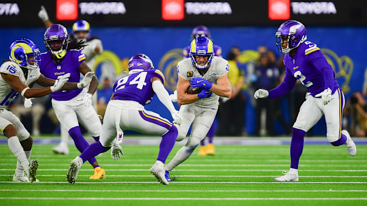 Oct 24, 2024; Inglewood, California, USA; Los Angeles Rams wide receiver Cooper Kupp (10) runs the ball against Minnesota Vikings safety Camryn Bynum (24) and cornerback Stephon Gilmore (2) during the second half at SoFi Stadium. Mandatory Credit: Gary A. Vasquez-Imagn Images