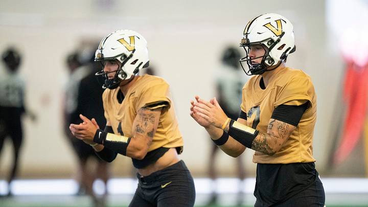 Vanderbilt quarterbacks Blaze Berlowitz (1) and Jared Curtis (2) go through drills during preseason practice at the school’s indoor facility Friday, Aug. 14, 2026. Vanderbilt quarterbacks Blaze Berlowitz (1) and Jared Curtis (2) go through drills during preseason practice at the school’s indoor facility Friday, Aug. 14, 2026.