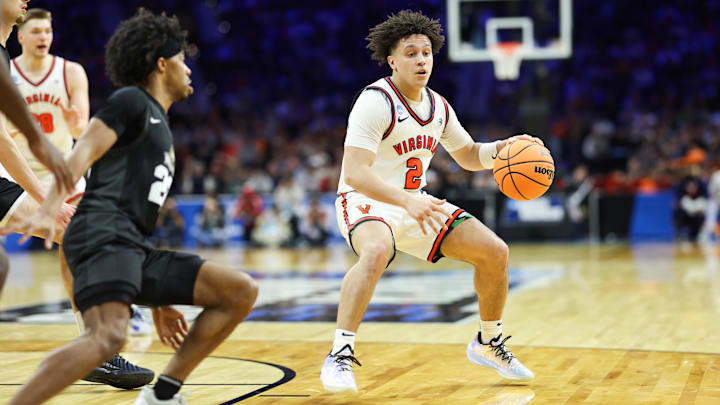 Virginia Cavaliers guard Chance Mallory and Wright State Raiders guard TJ Burch 