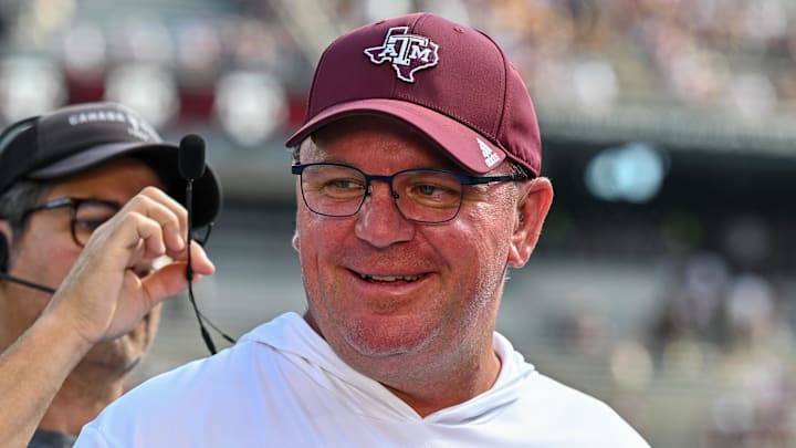 Oct 5, 2024; College Station, Texas, USA; Texas A&M Aggies head coach Mike Elko gets ready for a pre-game interview with the SEC Nation prior to the game against the Missouri Tigers at Kyle Field. Mandatory Credit: Maria Lysaker-Imagn Images. 