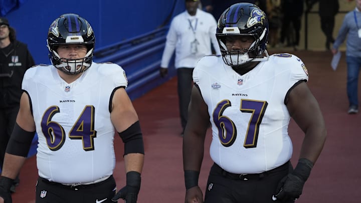 Sep 7, 2025; Orchard Park, New York, USA; Baltimore Ravens center Tyler Linderbaum (64) and center Corey Bullock (67) enter the field for warm up prior to the game against the Buffalo Bills at Highmark Stadium. Mandatory Credit: Gregory Fisher-Imagn Images Sep 7, 2025; Orchard Park, New York, USA; Baltimore Ravens center Tyler Linderbaum (64) and center Corey Bullock (67) enter the field for warm up prior to the game against the Buffalo Bills at Highmark Stadium. Mandatory Credit: Gregory Fisher-Imagn Images