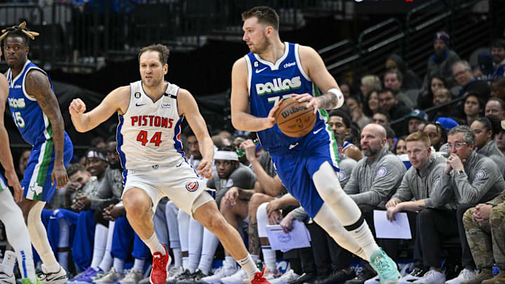 Jan 30, 2023; Dallas, Texas, USA; Dallas Mavericks guard Luka Doncic (77) looks to move the ball past Detroit Pistons forward Bojan Bogdanovic (44) during the second half at the American Airlines Center. Mandatory Credit: Jerome Miron-Imagn Images