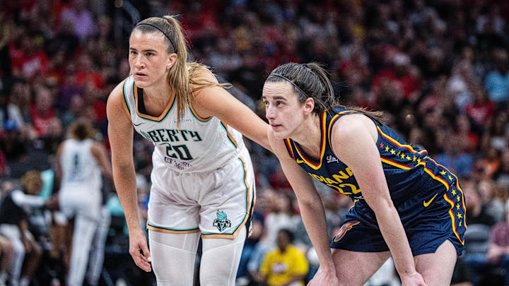 Jun 14, 2025; Indianapolis, Indiana, USA; New York Liberty guard Sabrina Ionescu (20) and Indiana Fever guard Caitlin Clark (22)  in the second half at Gainbridge Fieldhouse. Mandatory Credit: Trevor Ruszkowski-Imagn Images