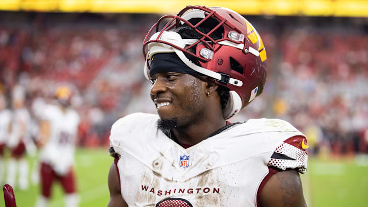 Sep 29, 2024; Glendale, Arizona, USA; Washington Commanders running back Brian Robinson Jr. (8) against the Arizona Cardinals at State Farm Stadium. Mandatory Credit: Mark J. Rebilas-Imagn Images