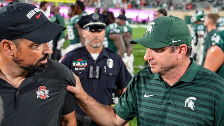 Michigan State Spartans head coach Jonathan Smith shakes hands with Ohio State Buckeyes head coach Ryan Day after the NCAA football game against Ohio State University at Spartan Stadium in East Lansing, Saturday, Sept. 28, 2024.