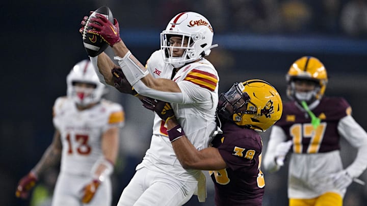 Dec 7, 2024; Arlington, TX, USA; Iowa State Cyclones wide receiver Jayden Higgins (9) catches a pass in front of Arizona State Sun Devils defensive back Kyan McDonald (38) during the second half at AT&T Stadium. Mandatory Credit: Jerome Miron-Imagn Images