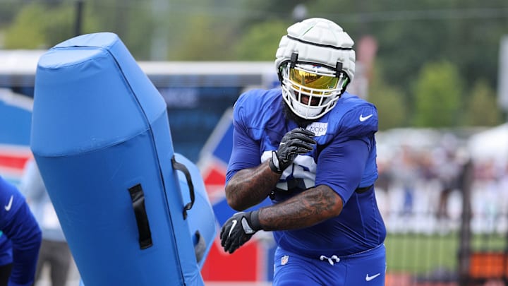 Bills defensive lineman DaQuan Jones hitting a blocking dummy during training camp.