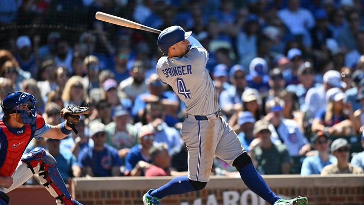Jun 19, 2026; Chicago, Illinois, USA; Toronto Blue Jays designated hitter George Springer (4) hits a home run against the Chicago Cubs during the sixth inning at Wrigley Field. Mandatory Credit: Patrick Gorski-Imagn Images