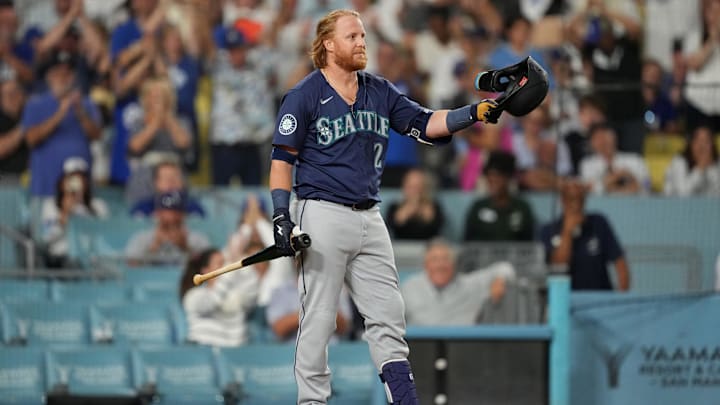 Aug 20, 2024; Los Angeles, California, USA; Seattle Mariners first baseman Justin Turner (2) acknowledges the crowd during the game against the Los Angeles Dodgers at Dodger Stadium. Mandatory Credit: Kirby Lee-Imagn Images