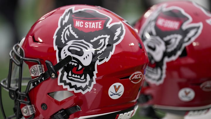 Dec 30, 2022; Charlotte, NC, USA; North Carolina State Wolfpack helmets during the first half against the Maryland Terrapins in the 2022 Duke's Mayo Bowl at Bank of America Stadium. Mandatory Credit: Jim Dedmon-Imagn Images