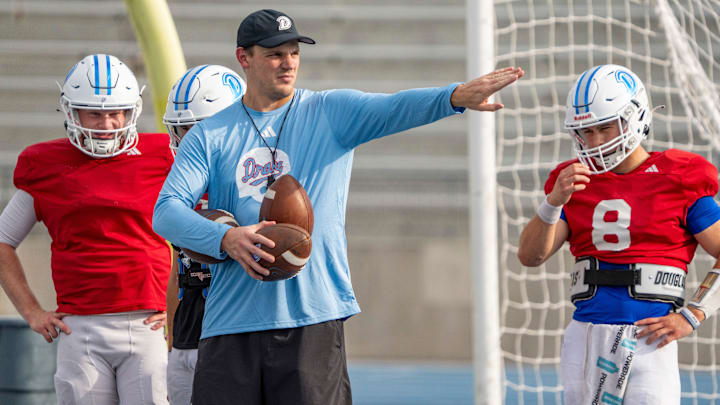 Drake offensive coordinator and quarterbacks coach Kyle Kempt works with players during practice, Sept. 30, 2025. Drake offensive coordinator and quarterbacks coach Kyle Kempt works with players during practice, Sept. 30, 2025.