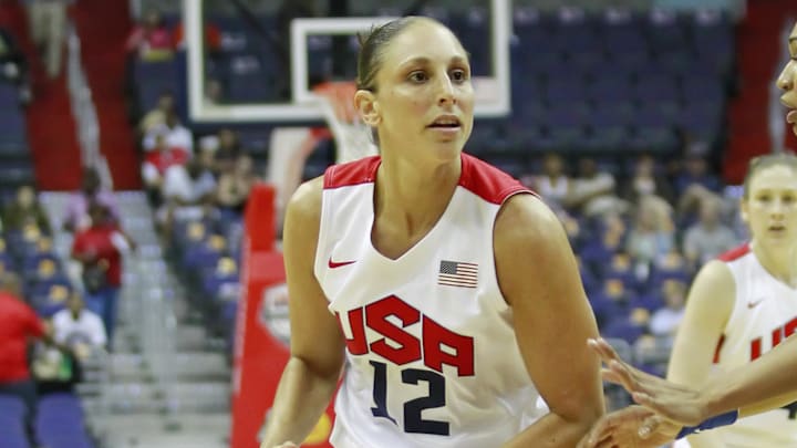 July 16, 2012; Washington, DC, USA; United States guard Diana Taurasi (12) dribbles the ball against team Brazil at Verizon Center. Team USA won 99-67. Mandatory Credit: Geoff Burke-Imagn Images