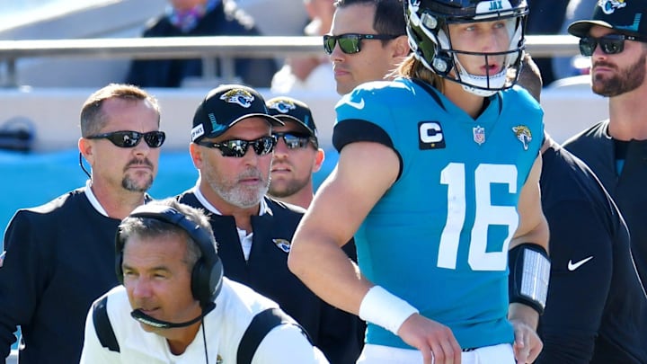 Jacksonville Jaguars quarterback Trevor Lawrence (16) walks behind Jacksonville Jaguars head coach Urban Meyer as he returns to the sidelines after a second quarter injury that took him out of the game, Sunday, November 7, 2021. [Bob Self/Florida Times-Union]