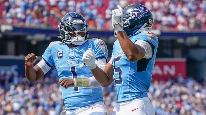 Tennessee Titans wide receiver Elic Ayomanor (5) celebrate swith Tennessee Titans quarterback Cam Ward (1) after a touchdown against the Los Angeles Rams during the second quarter at Nissan Stadium in Nashville, Tenn., Sunday, Sept. 14, 2025.
