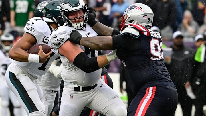 Sep 10, 2023; Foxborough, Massachusetts, USA; Philadelphia Eagles center Cam Jurgens (51) tries to block New England Patriots defensive tackle Davon Godchaux (92) during the first half at Gillette Stadium. Mandatory Credit: Eric Canha-Imagn Images
