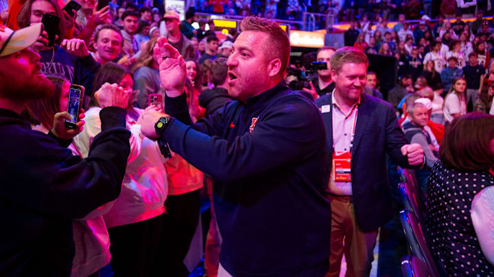 Newly hired Auburn football head coach Alex Golesh greets fans before Auburn Tigers take on NC State Wolfpack at Neville Arena in Auburn, Ala. on Wednesday, Dec. 3, 2025.