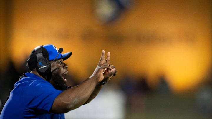 Catholic head coach Kirk Johnson talks with his team from the sideline at Montgomery Catholic Preparatory School in Montgomery, Ala., on Friday, Nov. 29, 2024. Montgomery Catholic defeated Vigor 21-7.