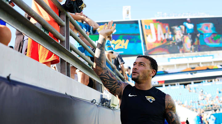 Jacksonville Jaguars tight end Evan Engram (17) greets fans during the ninth day of an NFL football training camp practice Saturday, Aug. 3, 2024 at EverBank Stadium in Jacksonville, Fla. Today marked the first day of public practice inside the stadium.