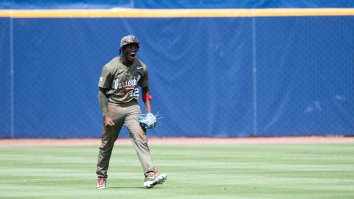 Vanderbilt Commodores' RJ Austin (42) celebrates after catching the final out as Ole Miss Rebels take on Vanderbilt Commodores during the SEC baseball tournament championship game at Hoover Met in Birmingham, Ala., on Sunday, May 25, 2025. Vanderbilt Commodores defeated Ole Miss Rebels 3-2. Vanderbilt Commodores' RJ Austin (42) celebrates after catching the final out as Ole Miss Rebels take on Vanderbilt Commodores during the SEC baseball tournament championship game at Hoover Met in Birmingham, Ala., on Sunday, May 25, 2025. Vanderbilt Commodores defeated Ole Miss Rebels 3-2.