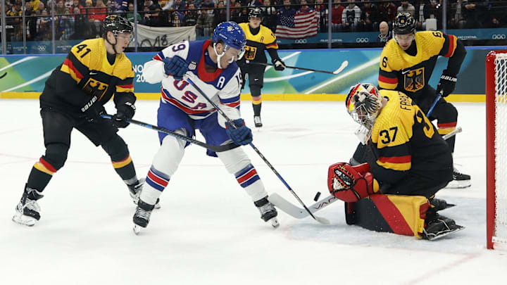 Feb 15, 2026; Milan, Italy; Matthew Tkachuk of United States in action with Maximilian Franzreb of Germany in men's ice hockey group C play during the Milano Cortina 2026 Olympic Winter Games at Milano Santagiulia Ice Hockey Arena. Mandatory Credit: Geoff Burke-Imagn Images Feb 15, 2026; Milan, Italy; Matthew Tkachuk of United States in action with Maximilian Franzreb of Germany in men's ice hockey group C play during the Milano Cortina 2026 Olympic Winter Games at Milano Santagiulia Ice Hockey Arena. Mandatory Credit: Geoff Burke-Imagn Images